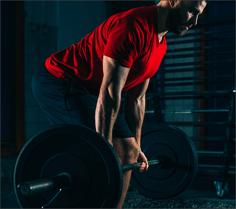 male-athlete-exercising-with-barbell-gym